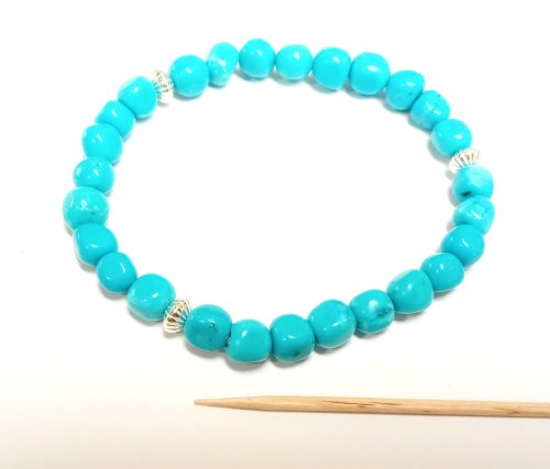 Judy Larson's Stretch Bracelets - , Beading, Beads, use the tip of a toothpick to coax it